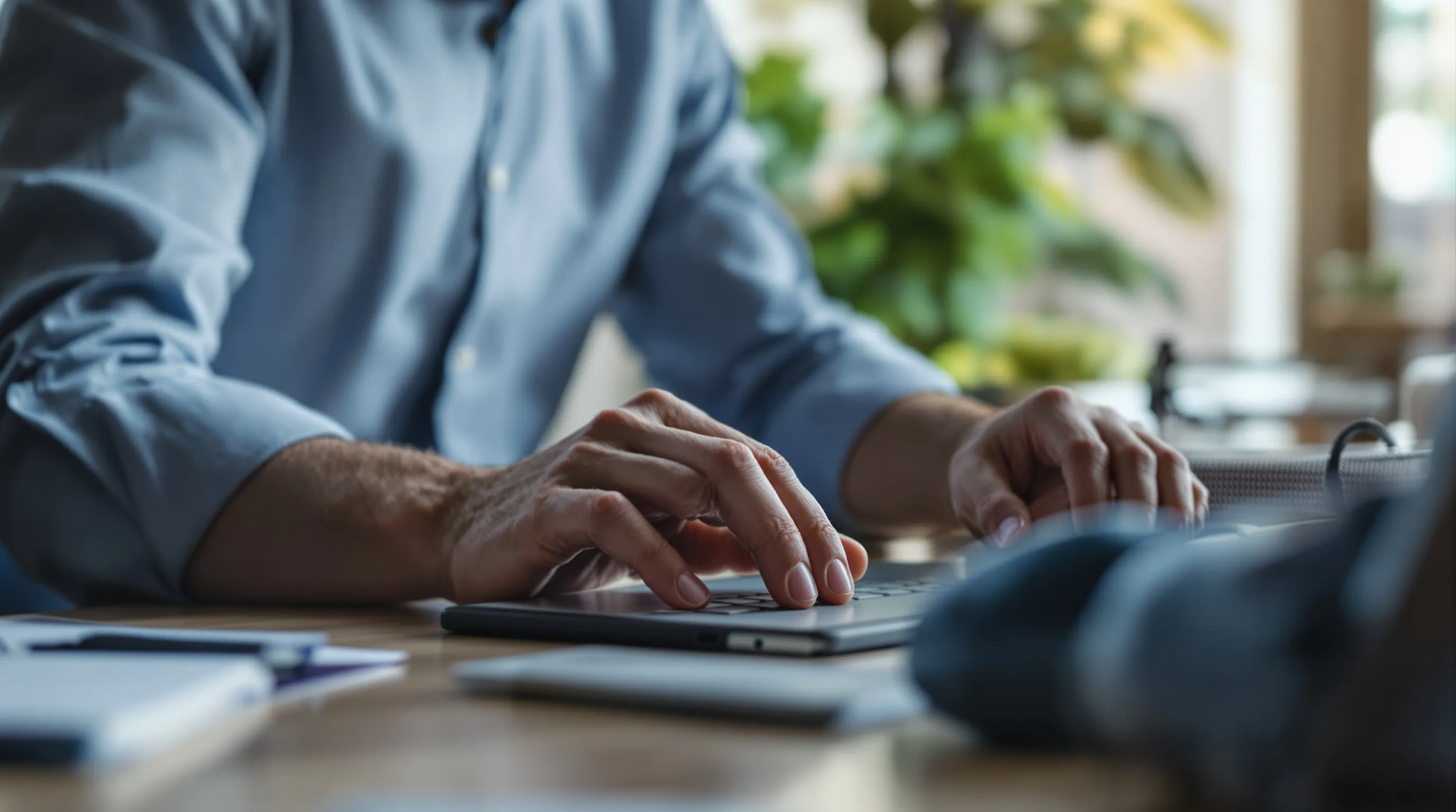 Business owner pausing before clicking a link in a suspicious account-closure email